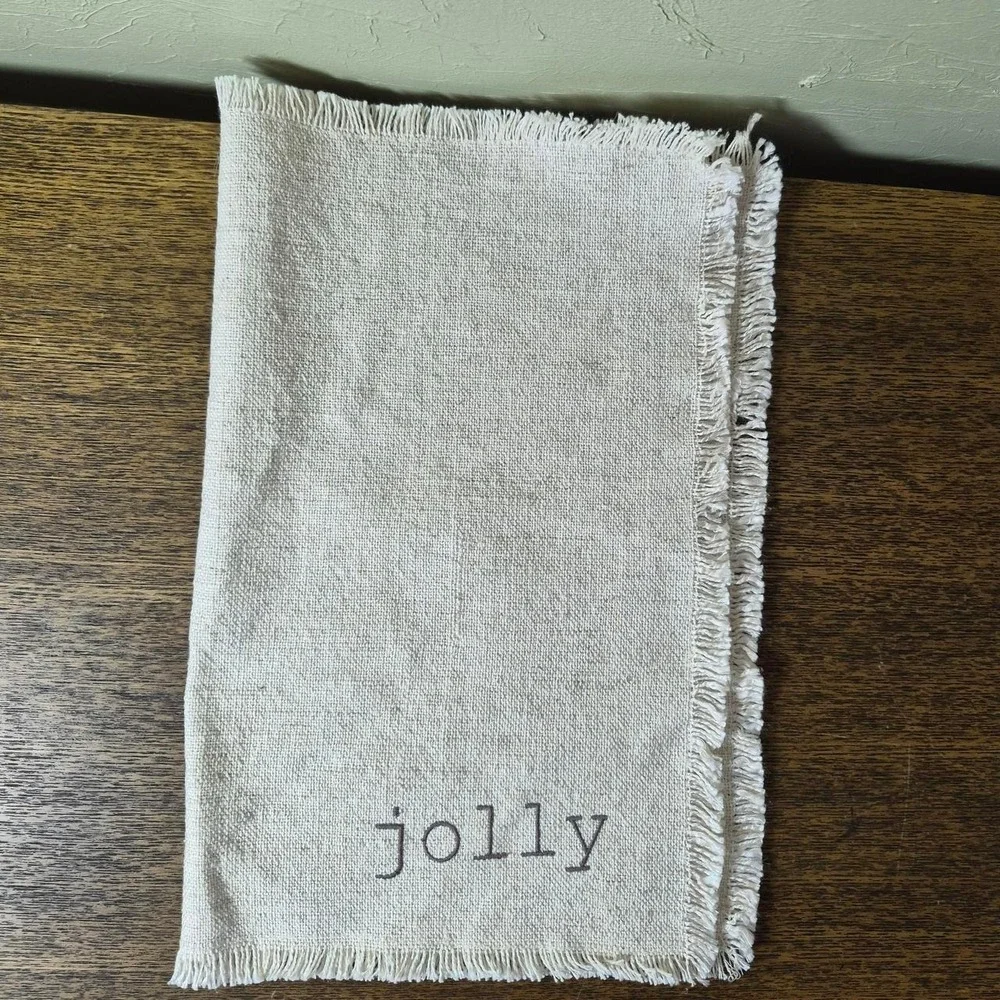 Cream Holiday Placemats (three total) - with the words 'jingle, jolly, & cheer'